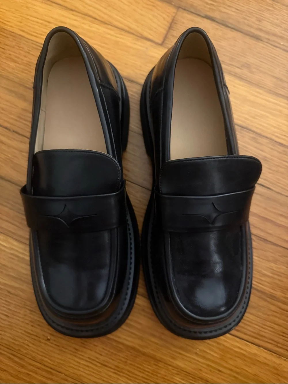 Black faux leather loafers with chunk sole